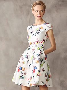 white dress with short sleeves and a flared mini flower pattern