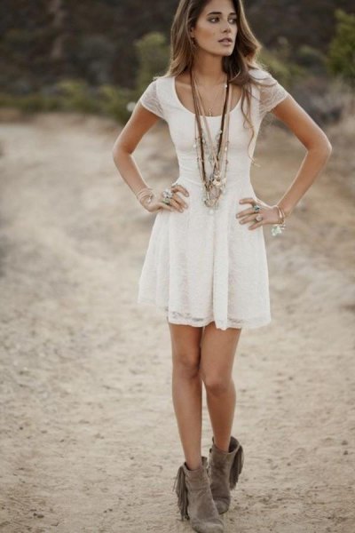 white short-sleeved dress with scoop neckline and flared mini dress