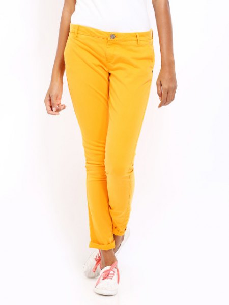 white short-sleeved T-shirt with lemon yellow slim fit trousers