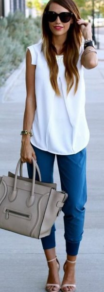 white sleeveless blouse blue jogger shorts