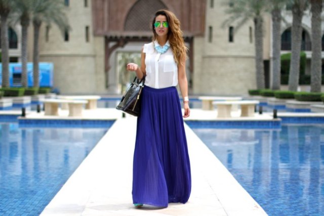 white sleeveless shirt with buttons and blue chiffon pleated maxi skirt