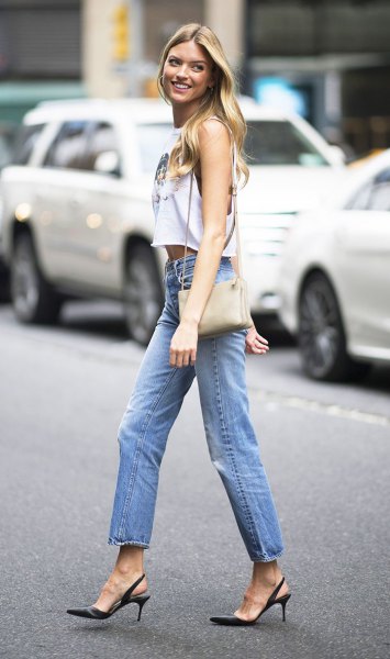 white sleeveless crop top with blue straight leg ankle jeans