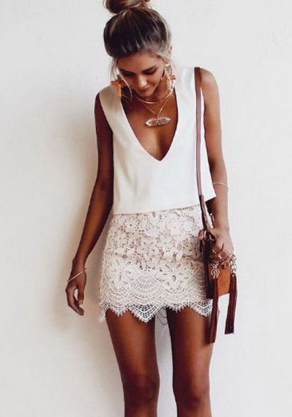 white sleeveless two-piece lace dress with plunging neckline