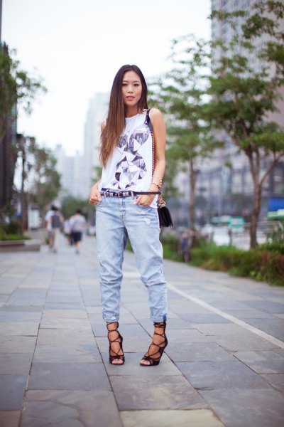 white t-shirt with sleeveless print and jogger jeans