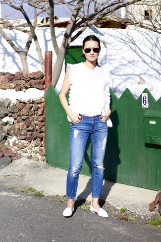 white sleeveless top with blue jeans and leather loafers