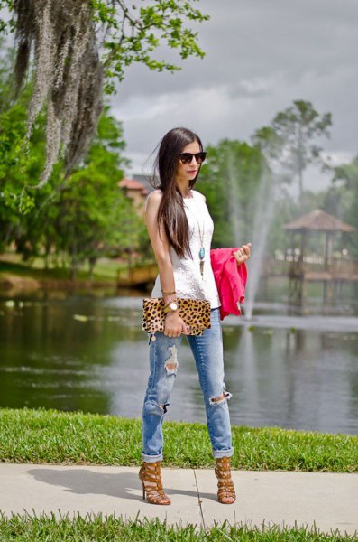 white sleeveless top with long boho necklace and clutch with leopard print