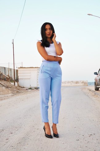 white sleeveless top with light blue, high-waisted ankle pants