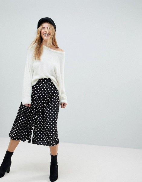white sweater black polka dot pants with wide legs