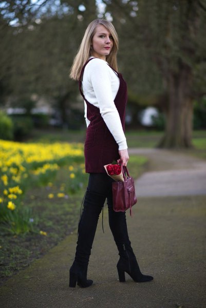 white sweater with black corduroy dress and black boots with high heels