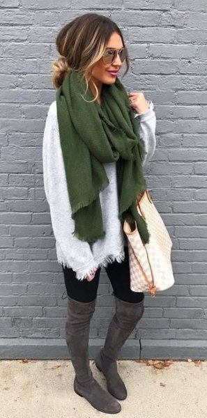 white sweater with a green scarf and gray overknee boots