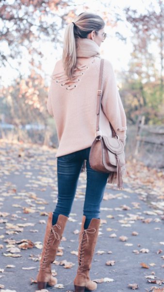 white sweater with high lace-up boots