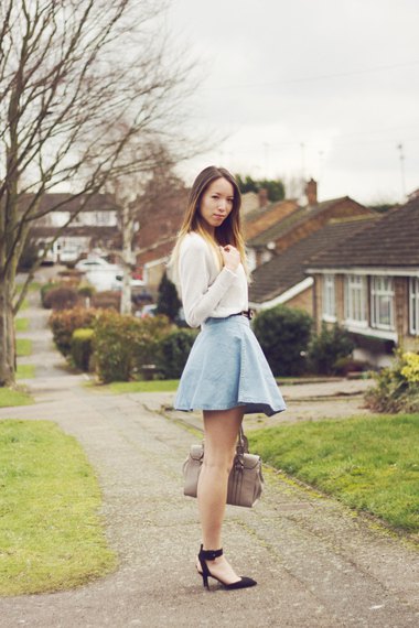 white sweater with light blue, high-waisted mini skirt