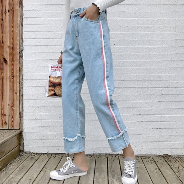 white sweater with light blue, pleated, cropped jeans and gray canvas sneakers