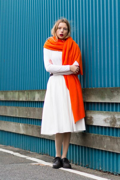 white sweater with matching midi flared skirt and orange long scarf