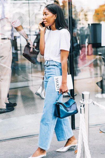white t-shirt with light blue high-rise jeans with wide legs