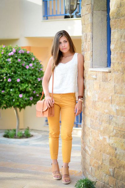 white tank top with mustard yellow, narrow ankle trousers