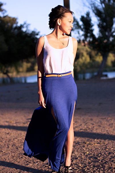 white tank top with yellow belt and blue, high split skirt