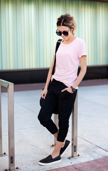 white t-shirt with black short sweatpants and canvas sneakers