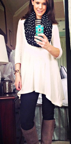 white tunic top with three-quarter sleeves and black infinity scarf with polka dots