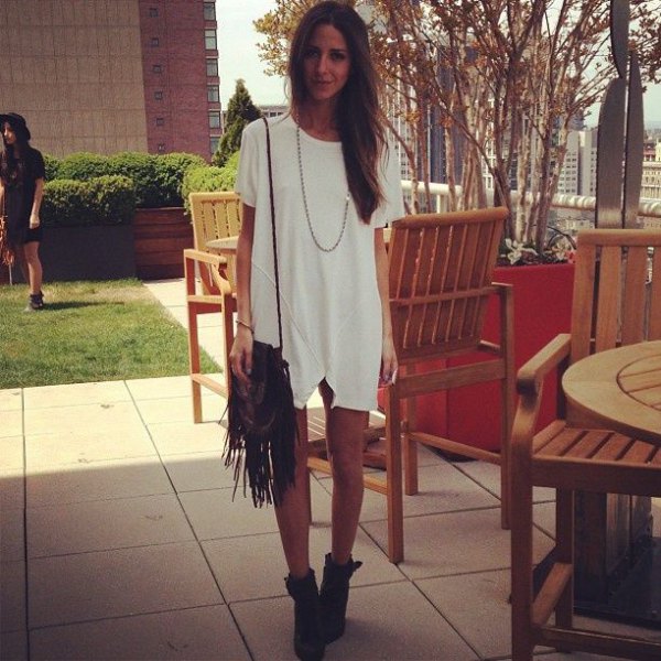 white tunic dress with fringed pocket and boots