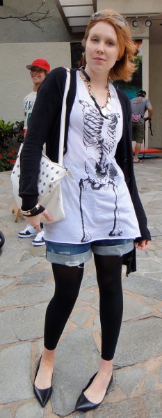 white tunic graphic tee with denim shorts and black footless tights