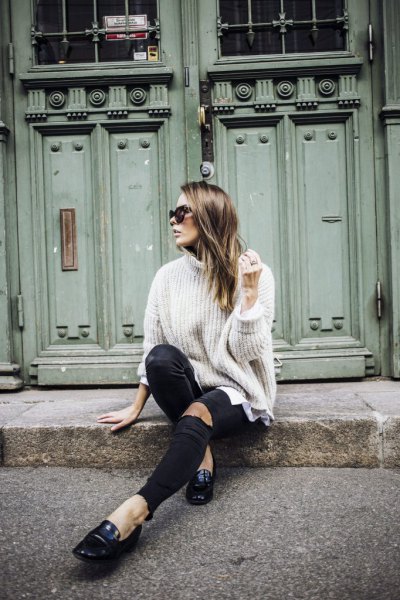 white turtleneck with turtleneck and black leather loafers