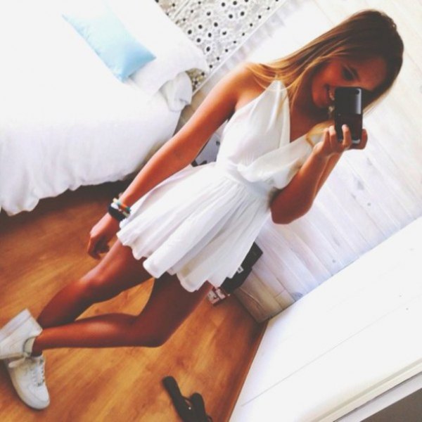 white, pleated and flared mini dress with V-neck