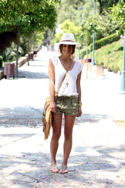 white tank top with V-neck, green shorts and fringed pocket