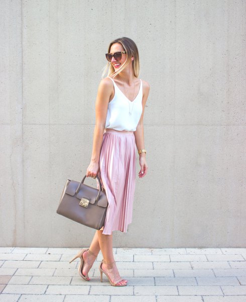 white vest top with V-neck and pink midi pleated skirt