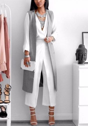 white trousers with wide legs and gray longline vest