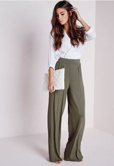white wrap blouse with gray pants with a high waist and wide legs