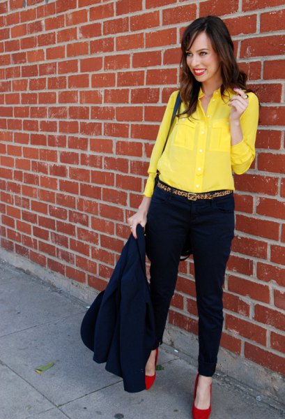 yellow shirt with buttons, black chinos and red heels