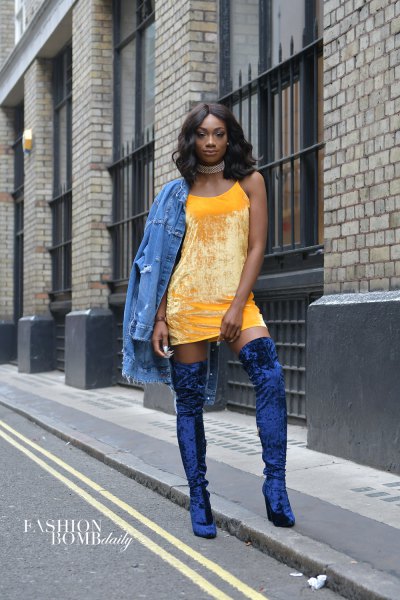 yellow mini shift dress with denim jacket and blue velvet boots