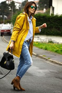 yellow oversized rain jacket with boyfriend shirt and ripped jeans