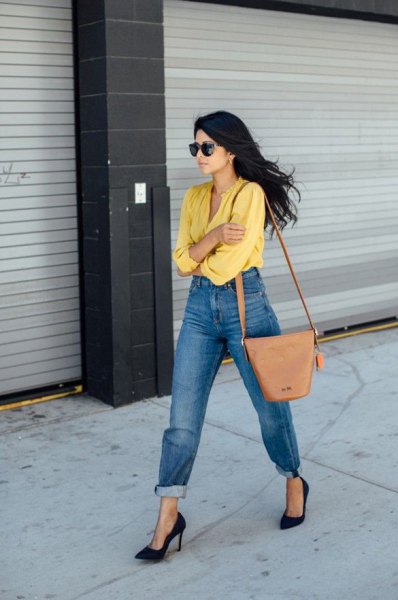 yellow shirt with tied washed mom jeans