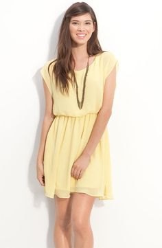 yellow sleeveless mini chiffon dress with a ruched waist