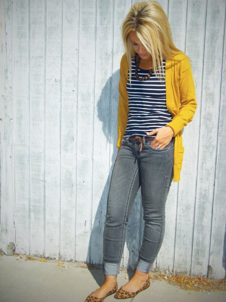 yellow pullover jacket with black and white striped tank top