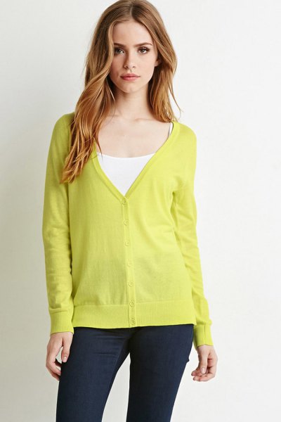 yellow cardigan with V-neck and white vest